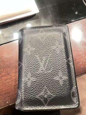 Authentic LV Black Leather Card Holder one year old in great condition!